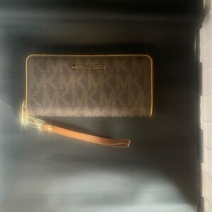 Michael Michael Kor Jet Set Zip Around Continental Brown PVC Wallet With MK Logo